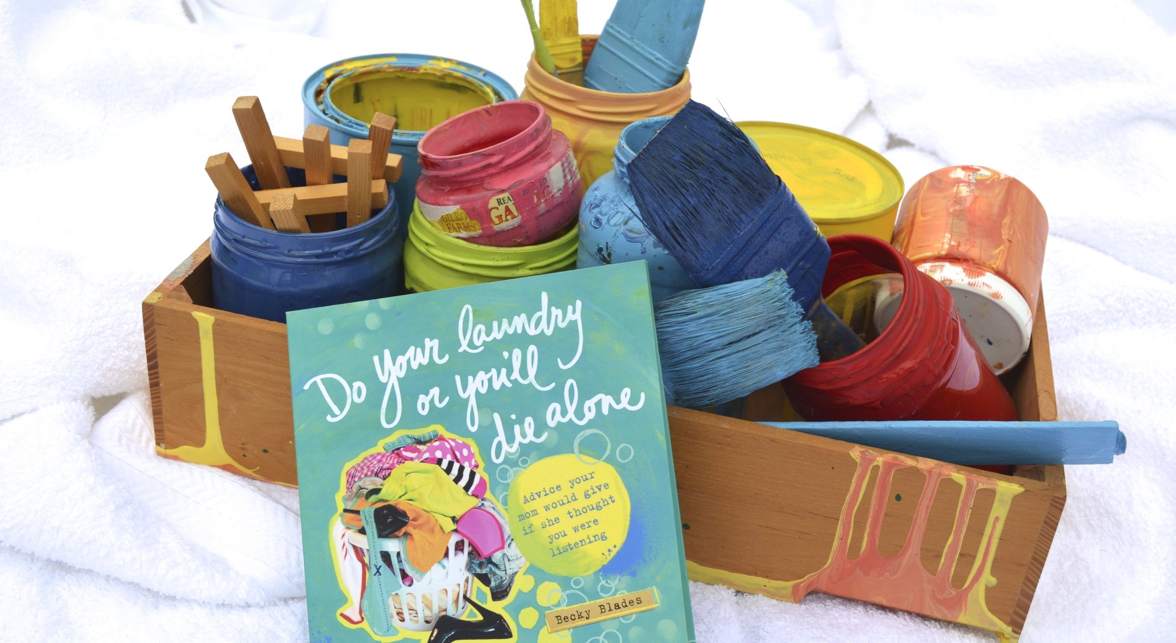 do your laundry or you'll die alone book with crafting materials and paint